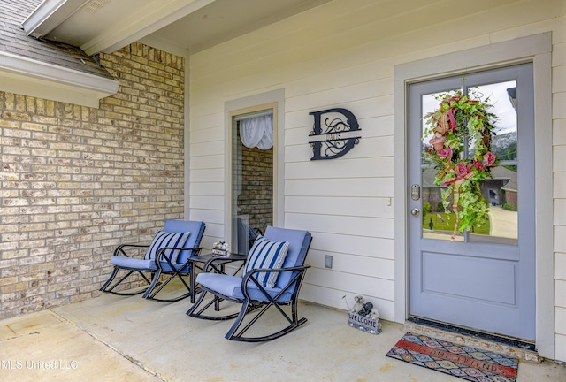 598 Westfield Dr, Pearl, MS 39208 - view of exterior entry featuring brick siding and a porch