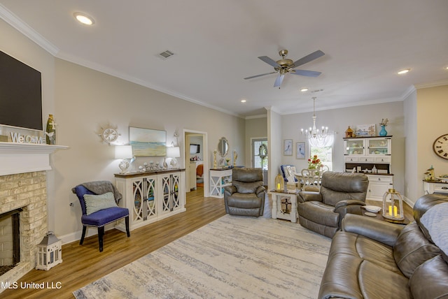 598 Westfield Dr, Pearl, MS 39208 - living area with wood finished floors, a brick fireplace, a ceiling fan, a chandelier, and recessed lighting