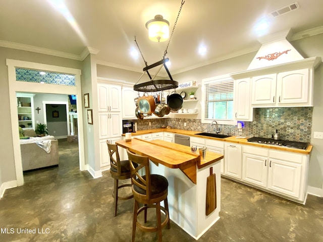115 Pinedale Rd, Terry, MS 39170 - kitchen with butcher block counters, a sink, gas stovetop, concrete flooring, and backsplash