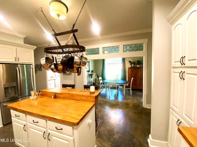 115 Pinedale Rd, Terry, MS 39170 - kitchen with wooden counters, stainless steel refrigerator with ice dispenser, ornamental molding, white cabinetry, and a center island