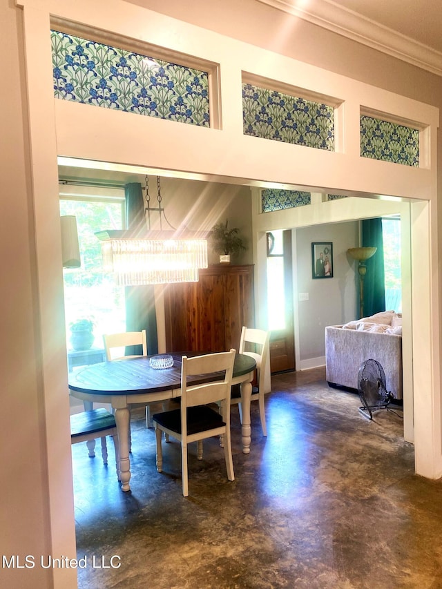 115 Pinedale Rd, Terry, MS 39170 - dining room with finished concrete floors, ornamental molding, and a towering ceiling
