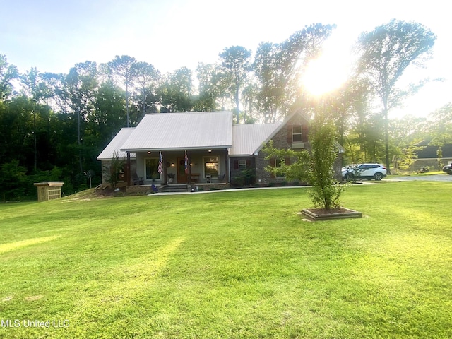 115 Pinedale Rd, Terry, MS 39170 - rear view of house with a yard, a porch, and metal roof