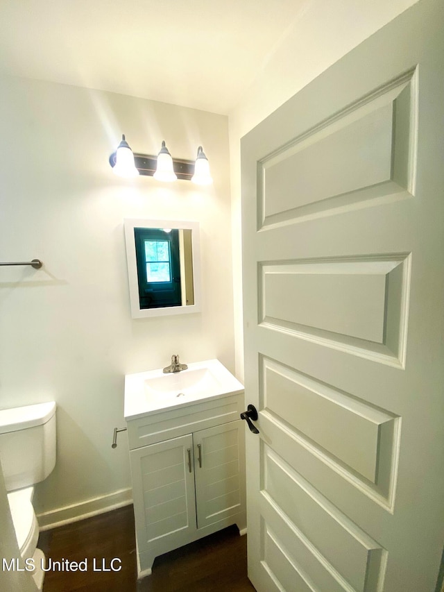 115 Pinedale Rd, Terry, MS 39170 - half bath with vanity and wood finished floors