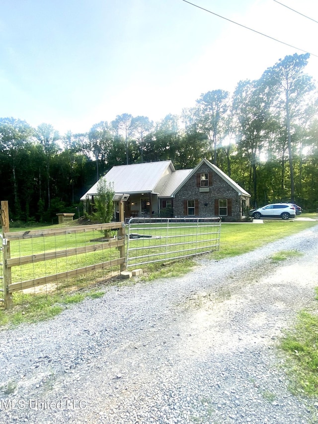 115 Pinedale Rd, Terry, MS 39170 - ranch-style home featuring a metal roof and a gate
