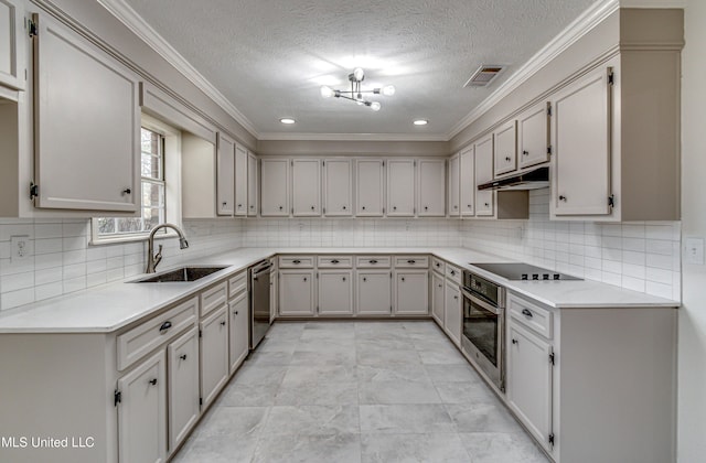 kitchen featuring a textured ceiling, ornamental molding, sink, and appliances with stainless steel finishes