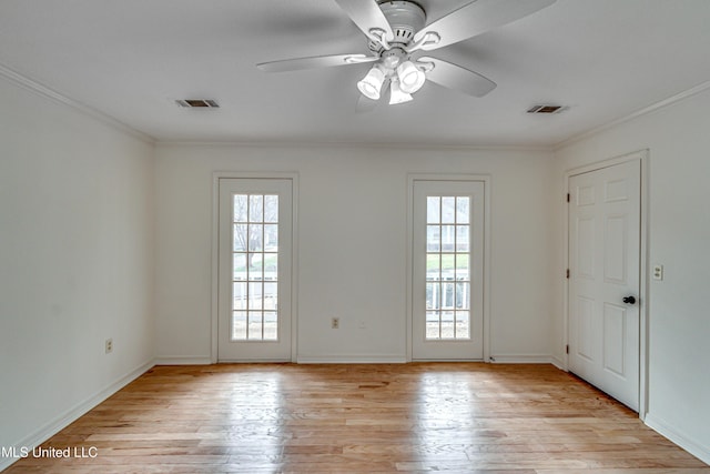 entryway featuring light hardwood / wood-style floors, a wealth of natural light, ornamental molding, and ceiling fan