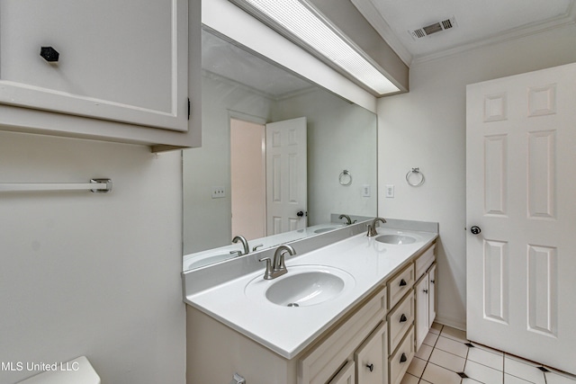 bathroom with tile patterned flooring, vanity, and ornamental molding