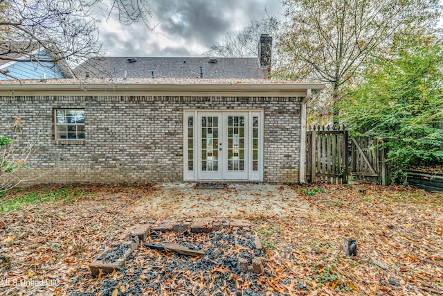 rear view of property with french doors