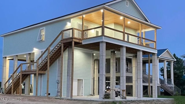 rear view of house featuring a balcony