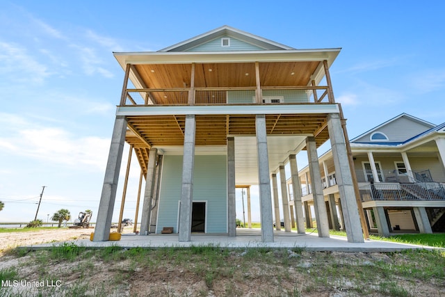 rear view of house with a balcony