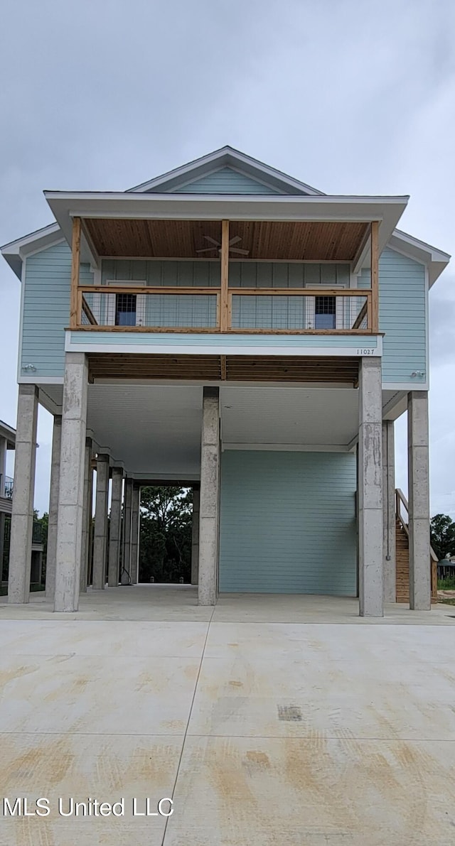 view of front of home with a carport