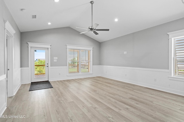 interior space with light hardwood / wood-style flooring, lofted ceiling, and ceiling fan