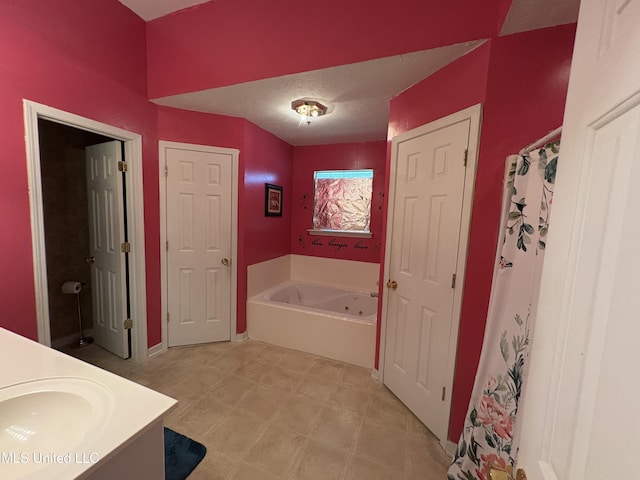 9831 Crooked Creek Blvd, Byram, MS 39272 - full bathroom featuring a tub with jets and vanity