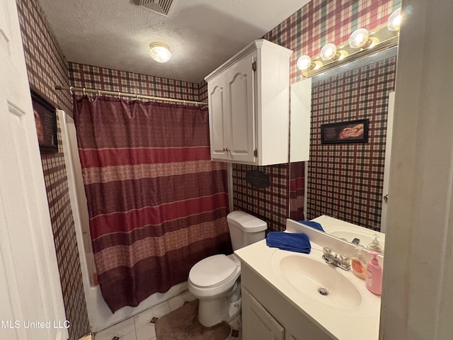 9831 Crooked Creek Blvd, Byram, MS 39272 - bathroom featuring wallpapered walls, toilet, vanity, a textured ceiling, and tile patterned floors