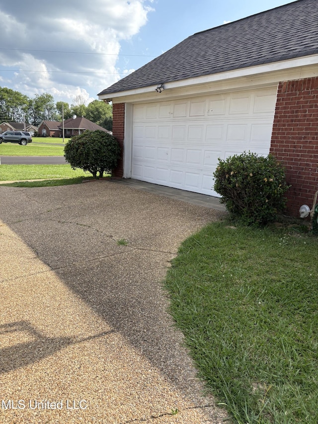 9831 Crooked Creek Blvd, Byram, MS 39272 - garage featuring concrete driveway