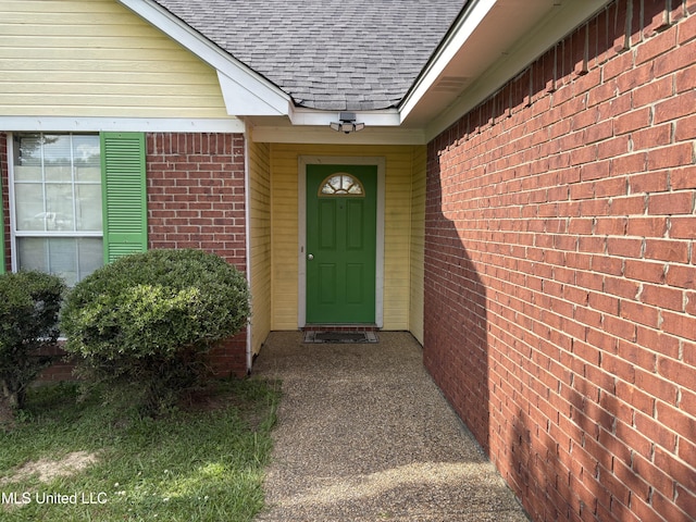 9831 Crooked Creek Blvd, Byram, MS 39272 - property entrance featuring roof with shingles and brick siding