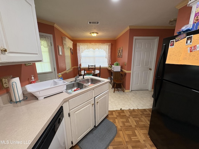 9831 Crooked Creek Blvd, Byram, MS 39272 - kitchen with freestanding refrigerator, a sink, white cabinets, light countertops, and ornamental molding