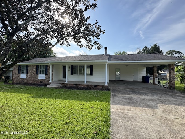 ranch-style home featuring covered porch, a front yard, an attached carport, crawl space, and concrete driveway