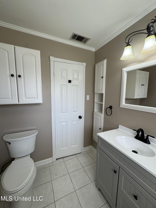 half bath with baseboards, ornamental molding, and visible vents