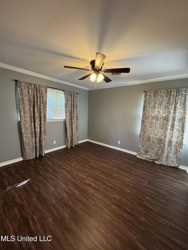 empty room with ceiling fan, dark wood-style floors, and ornamental molding