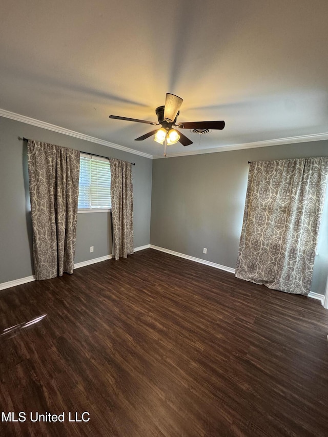 spare room with ceiling fan, baseboards, ornamental molding, and wood finished floors