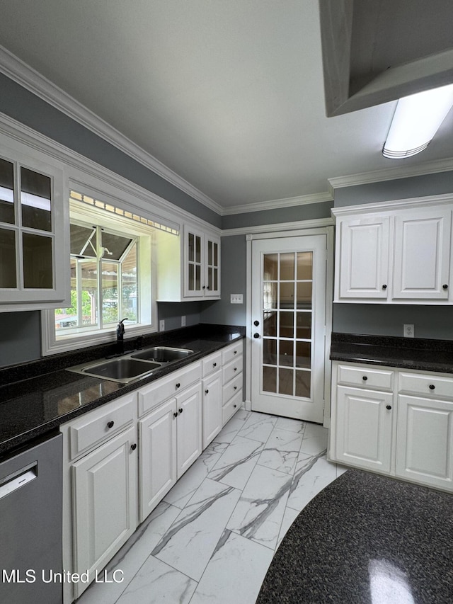kitchen featuring marble finish floor, glass insert cabinets, dishwashing machine, white cabinetry, and a sink