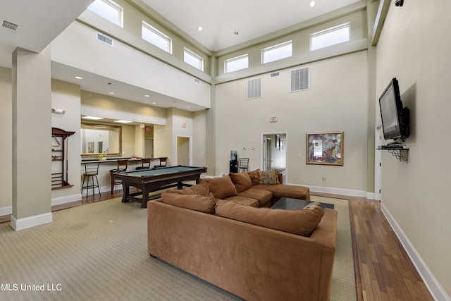 3230 Cumberand Rd Unit 56, Ocean Springs, MS 39564 - living room with billiards table, wood finished floors, a high ceiling, and baseboards