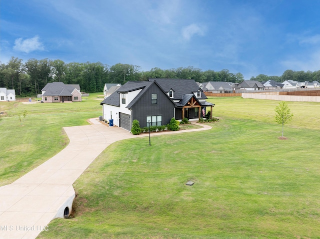 5267 Reserve Way, Hernando, MS 38632 - view of property exterior featuring driveway, board and batten siding, and a residential view