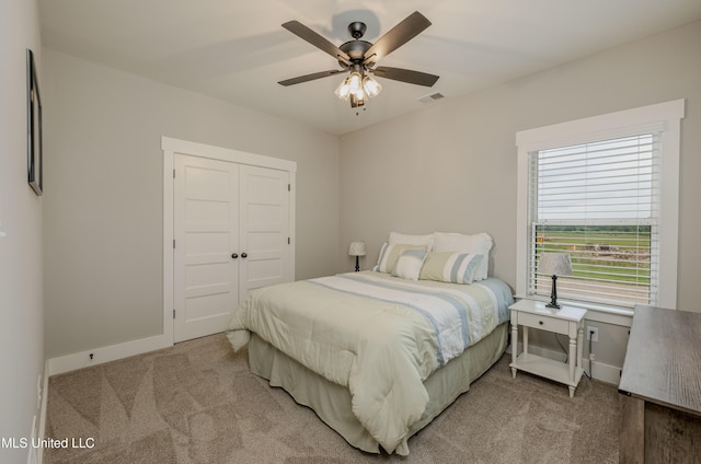 5267 Reserve Way, Hernando, MS 38632 - bedroom featuring light carpet, a closet, ceiling fan, and baseboards