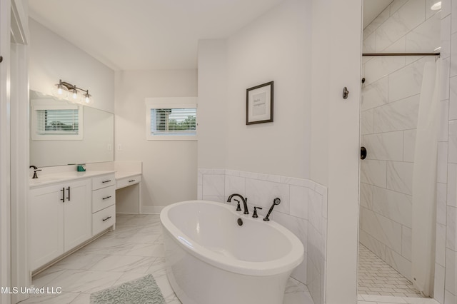 5267 Reserve Way, Hernando, MS 38632 - bathroom featuring marble finish flooring, a soaking tub, a tile shower, and vanity