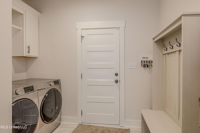 5267 Reserve Way, Hernando, MS 38632 - laundry room featuring washer and clothes dryer, cabinet space, and baseboards