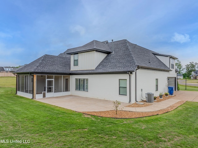 5267 Reserve Way, Hernando, MS 38632 - rear view of house featuring a sunroom, a shingled roof, a yard, and central AC