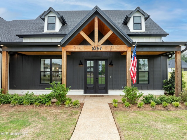 5267 Reserve Way, Hernando, MS 38632 - property entrance with french doors, board and batten siding, roof with shingles, and a yard