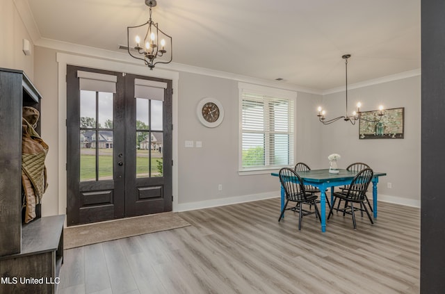 5267 Reserve Way, Hernando, MS 38632 - entrance foyer featuring a chandelier, french doors, wood finished floors, ornamental molding, and baseboards