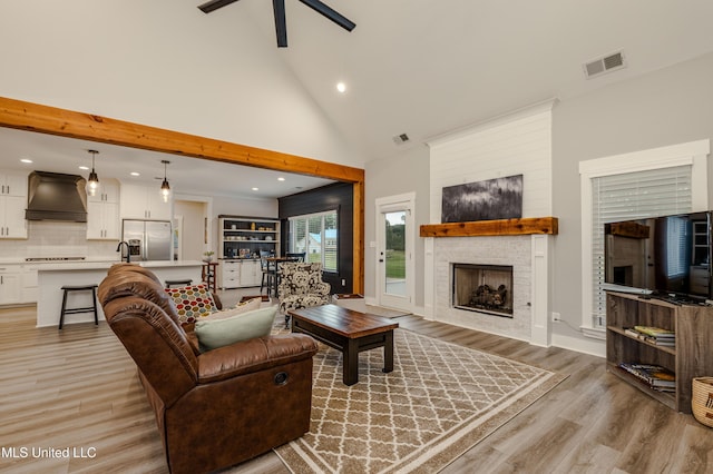 5267 Reserve Way, Hernando, MS 38632 - living room with light wood-type flooring, recessed lighting, a fireplace, a ceiling fan, and high vaulted ceiling