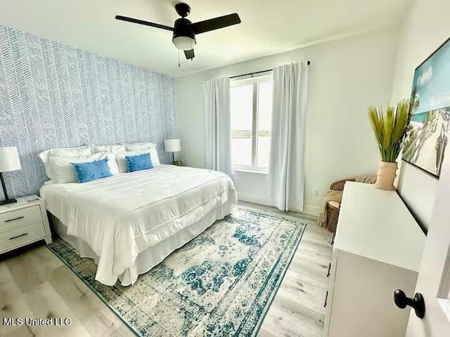 1302 Magnolia St Unit 202, Gulfport, MS 39507 - bedroom featuring light wood finished floors and a ceiling fan
