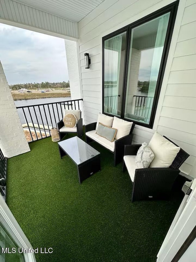 1302 Magnolia St Unit 202, Gulfport, MS 39507 - balcony with a water view and outdoor lounge area