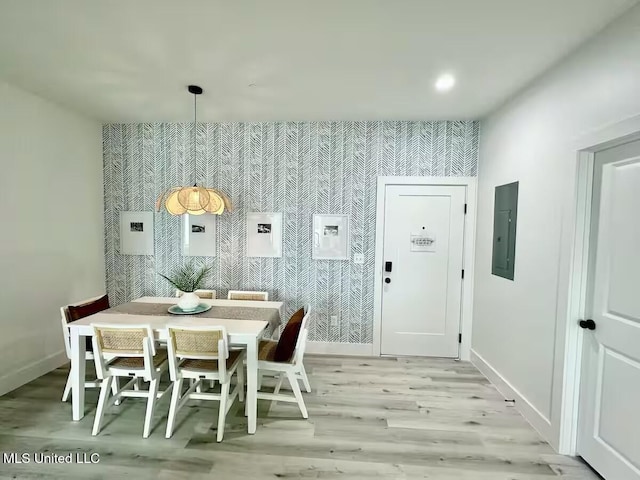 1302 Magnolia St Unit 202, Gulfport, MS 39507 - dining space with light wood finished floors, wallpapered walls, electric panel, and recessed lighting
