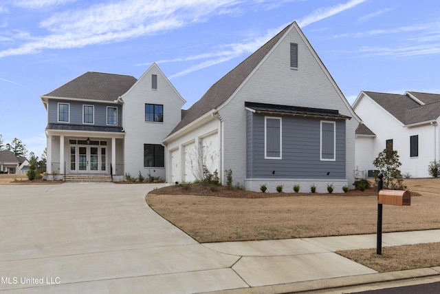 view of front facade with brick siding and driveway