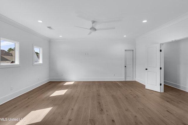 unfurnished room featuring crown molding, recessed lighting, visible vents, light wood-style flooring, and baseboards