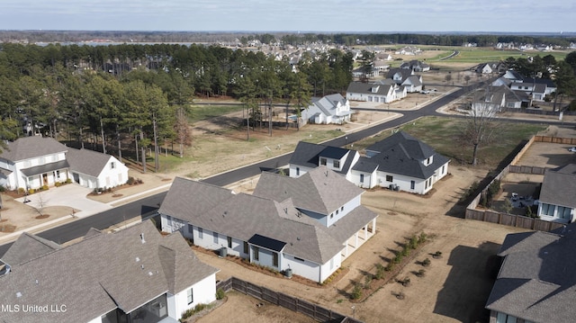 birds eye view of property with a residential view