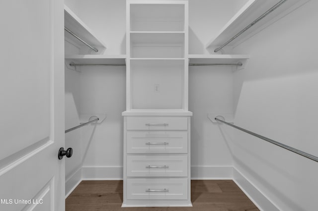 walk in closet featuring wood finished floors