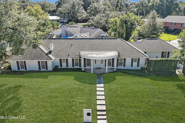 single story home with a front yard