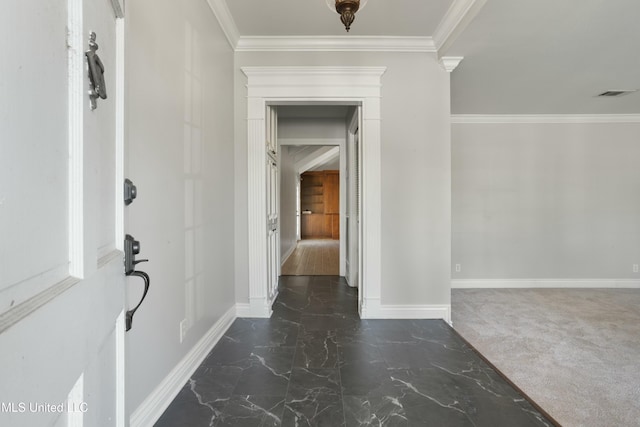 corridor with dark colored carpet and ornamental molding