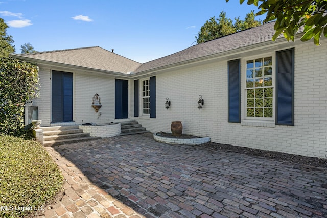 property entrance with a patio