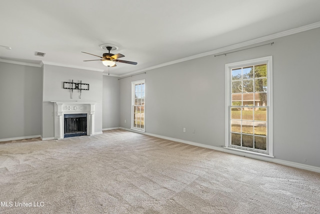 unfurnished living room with carpet, ceiling fan, and ornamental molding