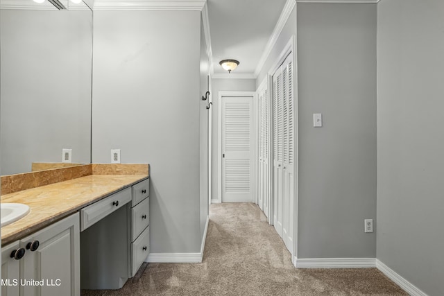 bathroom featuring vanity and ornamental molding