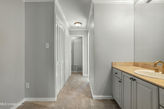 bathroom with vanity and ornamental molding