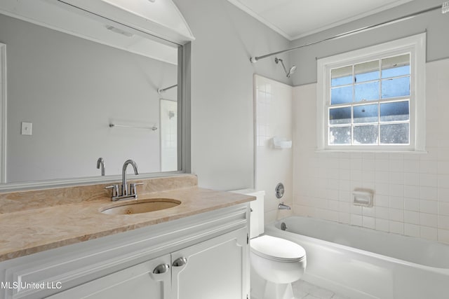 full bathroom with crown molding, toilet, vanity, and tiled shower / bath