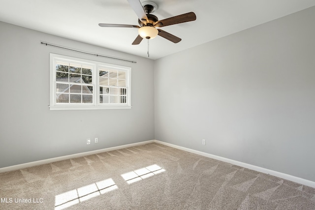 empty room featuring carpet and ceiling fan